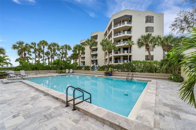 view of swimming pool with a patio area