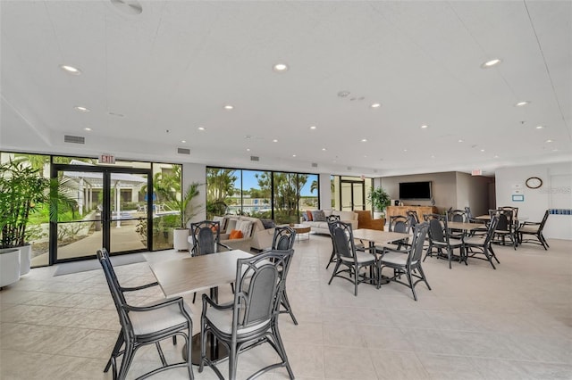 dining area featuring expansive windows