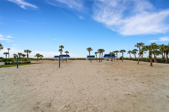 view of community featuring volleyball court and a water view