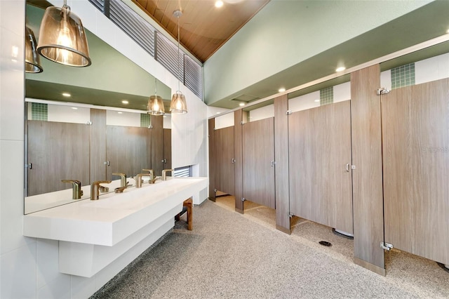 bathroom featuring vanity, wood ceiling, and wooden walls