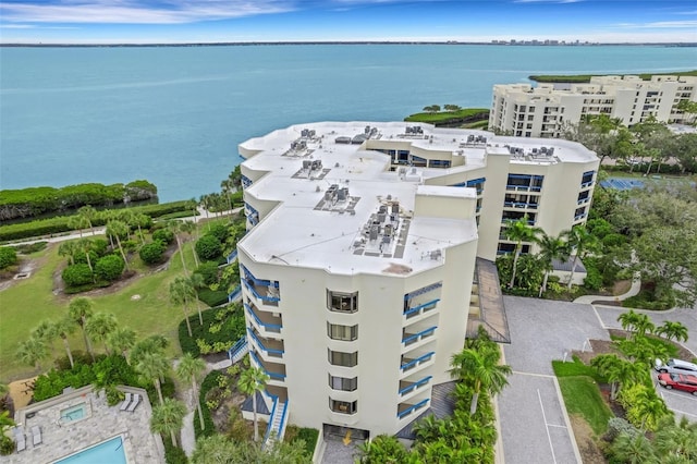 birds eye view of property with a water view