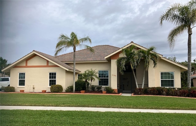 ranch-style home with a front yard