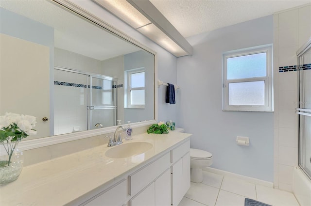 full bathroom with bath / shower combo with glass door, vanity, toilet, tile patterned floors, and a textured ceiling