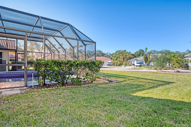 view of yard with a lanai