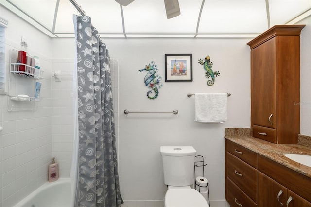 full bathroom featuring shower / bath combo, vanity, and toilet