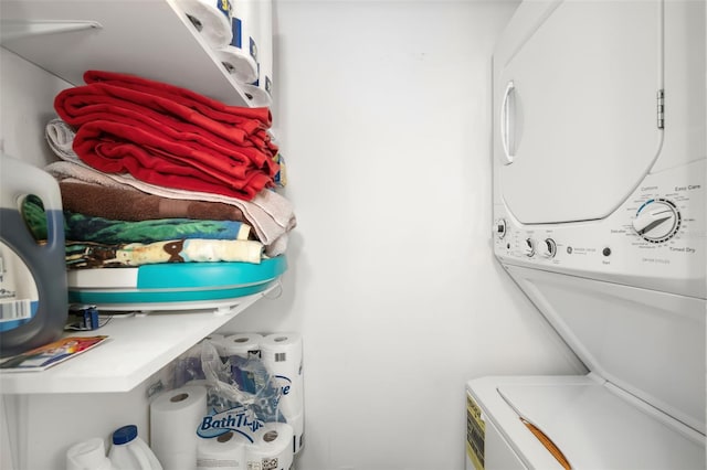 laundry area featuring stacked washing maching and dryer