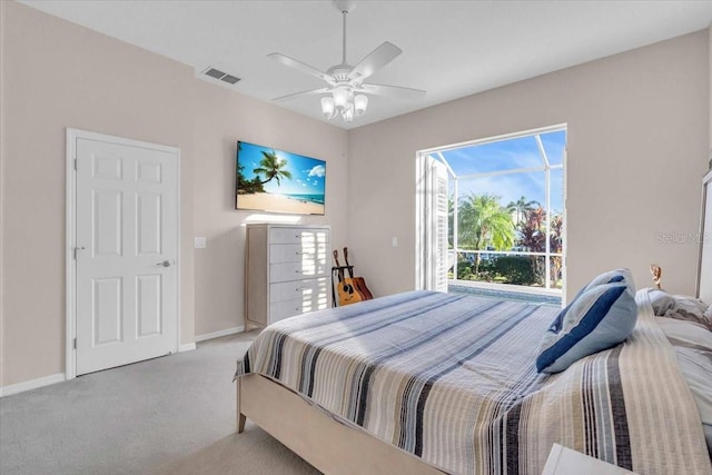 bedroom with ceiling fan and light colored carpet