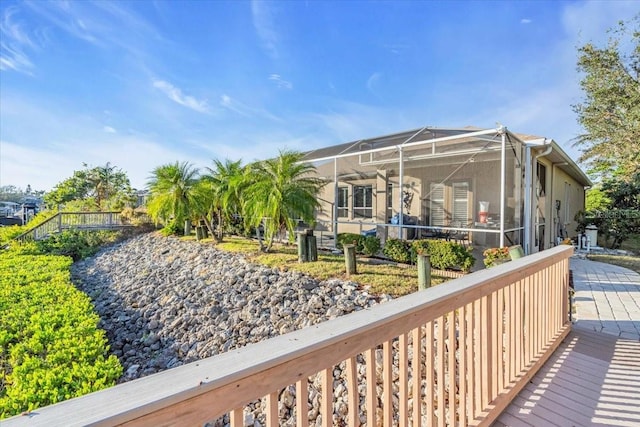 back of house featuring a lanai