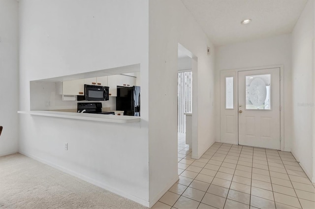 entrance foyer featuring light tile patterned floors