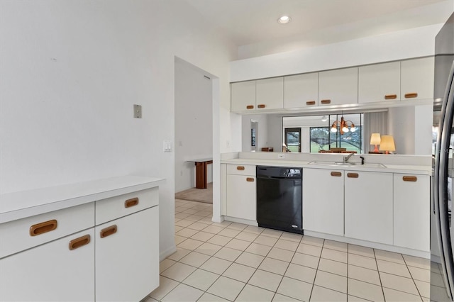 kitchen with light tile patterned floors, black dishwasher, sink, and white cabinets