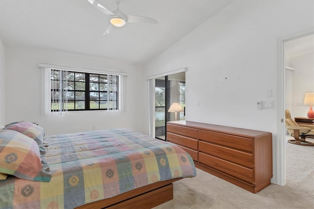 carpeted bedroom featuring a closet, ceiling fan, and vaulted ceiling