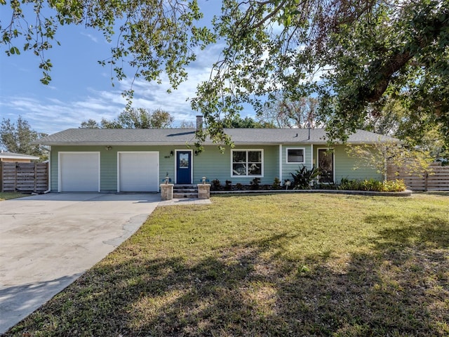 ranch-style home with a front lawn and a garage