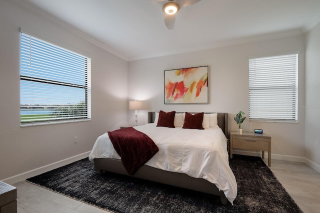 bedroom with ceiling fan, crown molding, and multiple windows