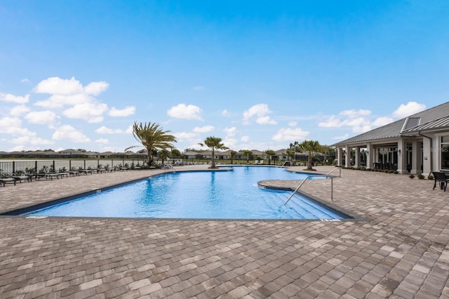 view of swimming pool featuring a patio