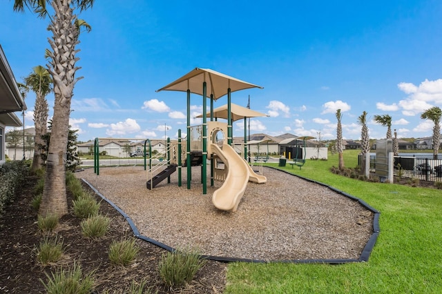 view of jungle gym with a lawn