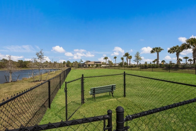 view of yard with a rural view and a water view