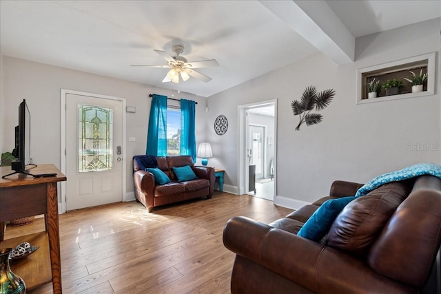 living room with ceiling fan and light wood-type flooring