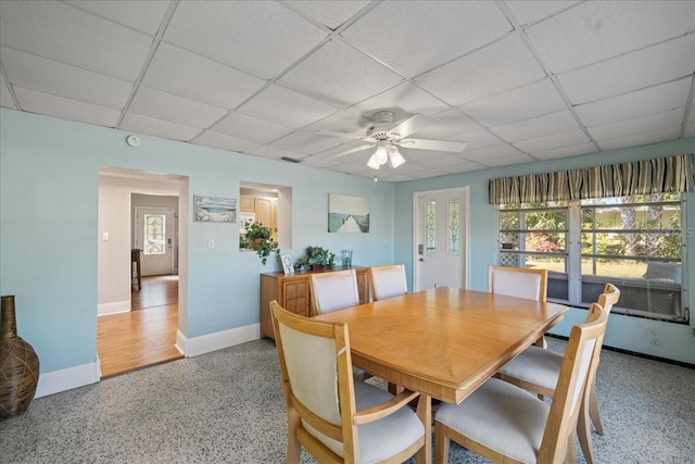 dining room with a paneled ceiling and ceiling fan