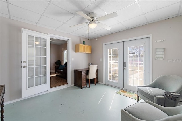 entryway featuring french doors, a paneled ceiling, and ceiling fan