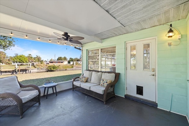 view of patio featuring ceiling fan