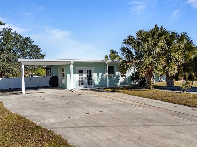 single story home with a carport