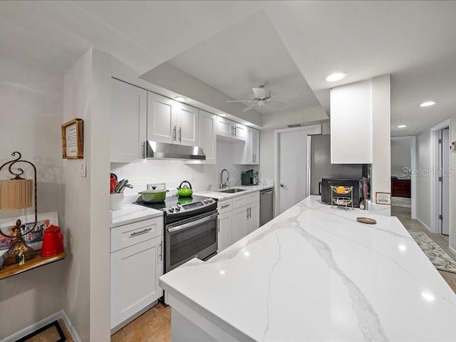 kitchen featuring white cabinets, appliances with stainless steel finishes, and sink