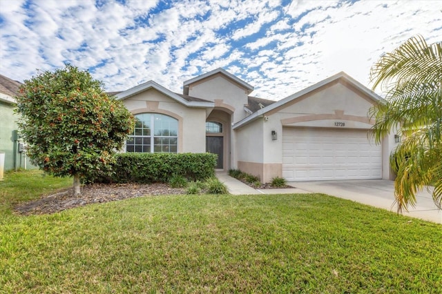 ranch-style home with a front yard and a garage