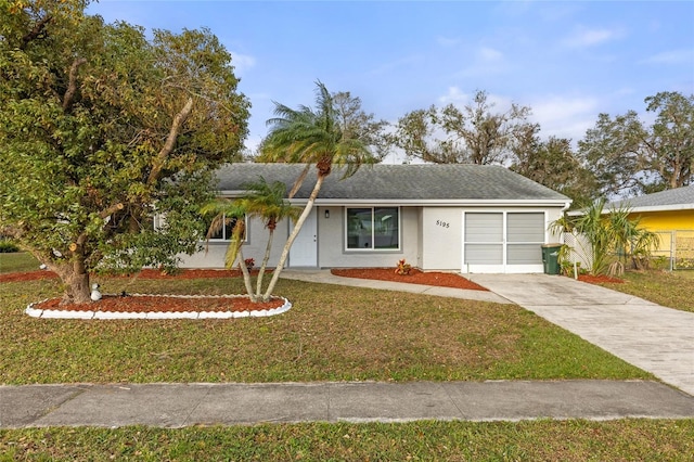 ranch-style house with a front lawn and a garage