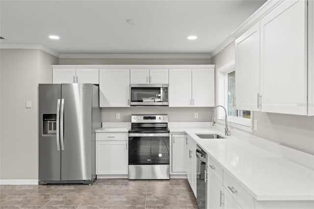 kitchen featuring white cabinetry, sink, crown molding, and appliances with stainless steel finishes