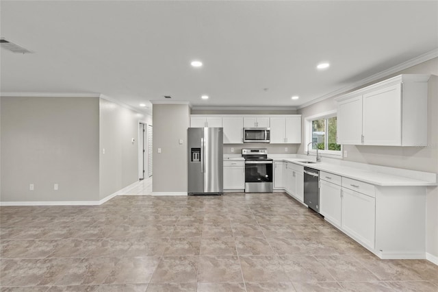 kitchen with white cabinets, ornamental molding, sink, and appliances with stainless steel finishes