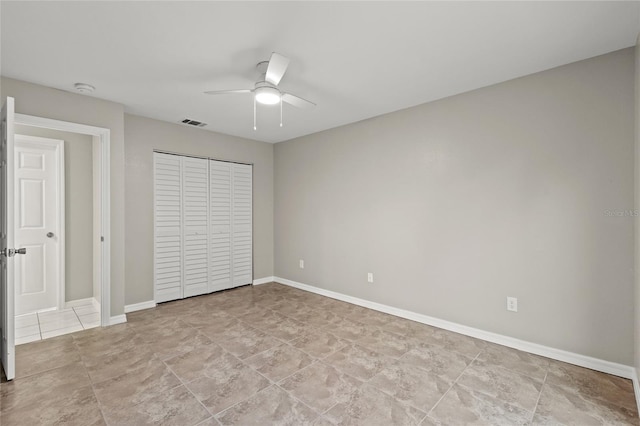 unfurnished bedroom featuring a closet and ceiling fan