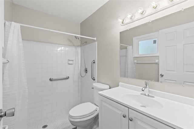 bathroom with a shower with curtain, vanity, and toilet