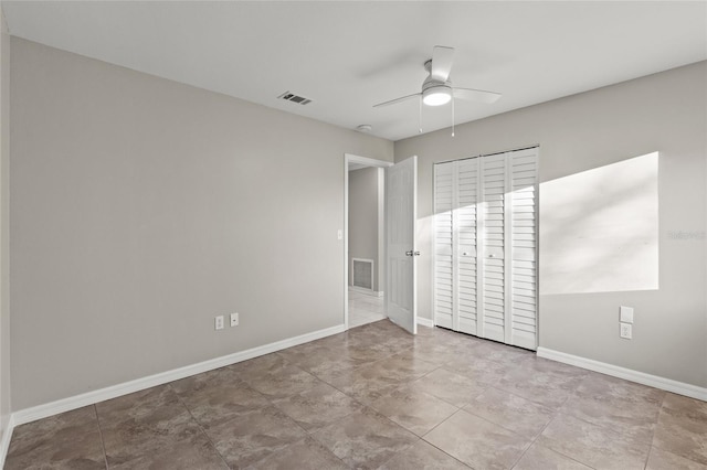 unfurnished bedroom with a closet and ceiling fan