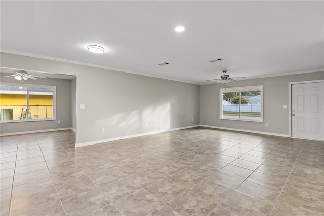 empty room with ceiling fan and ornamental molding