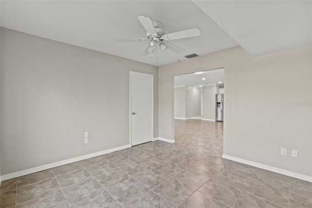 spare room with ceiling fan