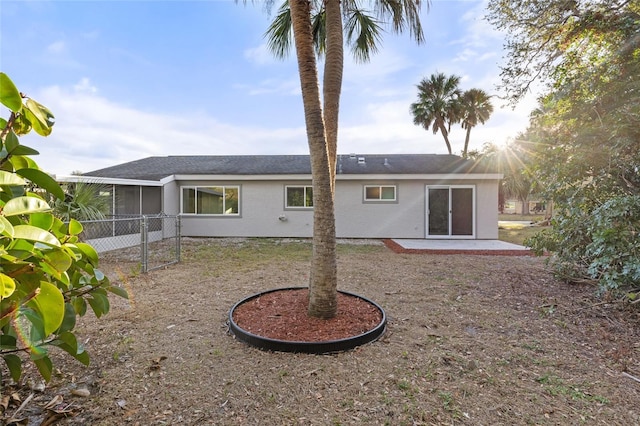 back of house with a patio and a sunroom