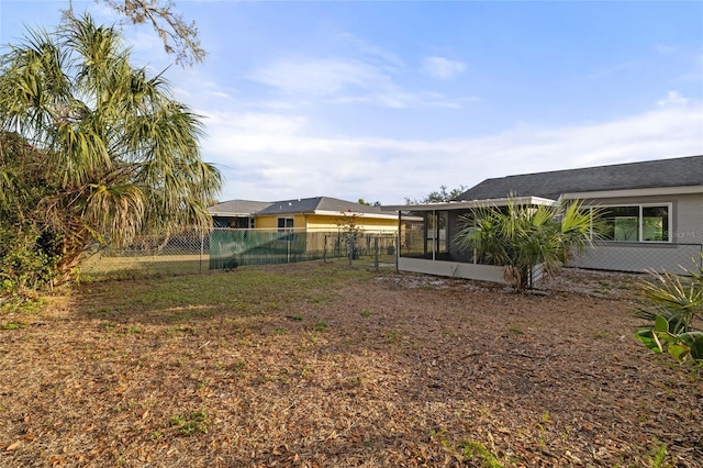 view of yard with a sunroom