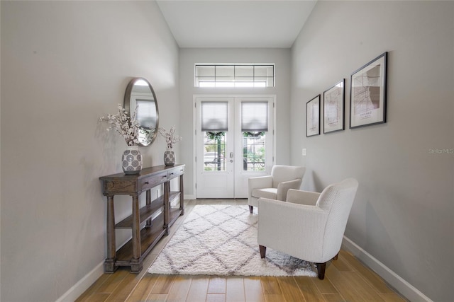 entryway with french doors and a high ceiling