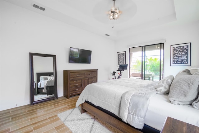 bedroom with ceiling fan and access to outside