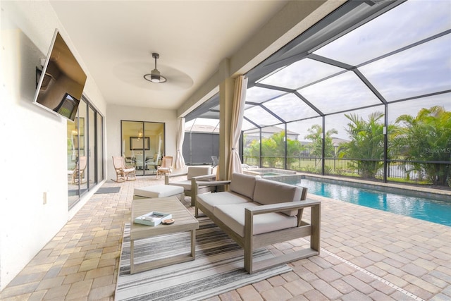 exterior space with a swimming pool with hot tub, a lanai, and an outdoor hangout area