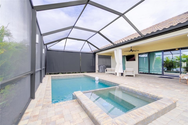 view of swimming pool featuring a lanai, ceiling fan, a patio, and an in ground hot tub