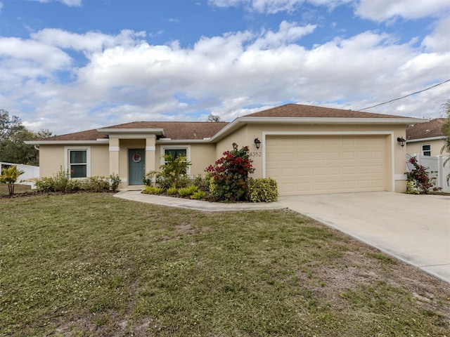 view of front facade featuring a garage and a front lawn