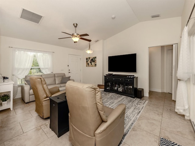 tiled living room featuring vaulted ceiling and ceiling fan