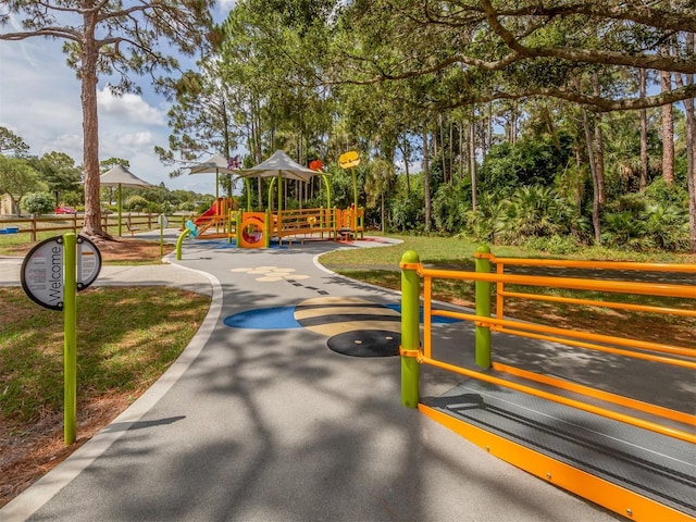 view of property's community with a playground