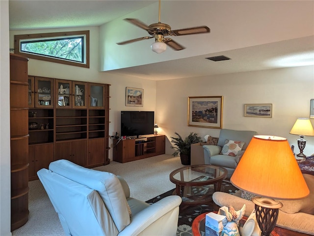 living room featuring carpet floors, high vaulted ceiling, and ceiling fan