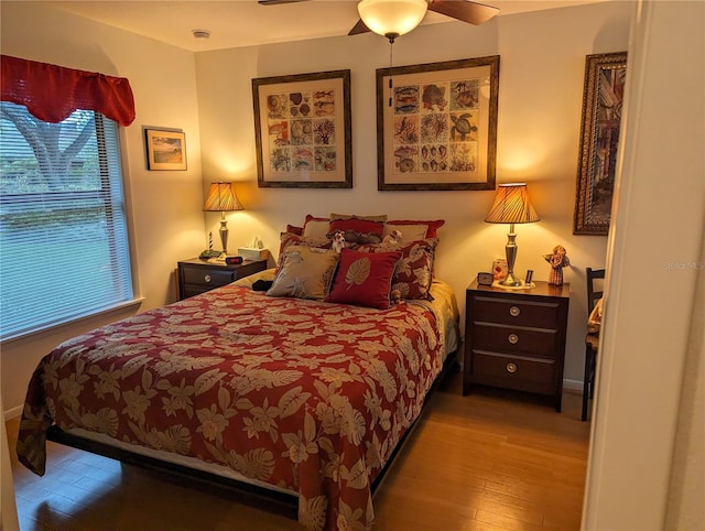 bedroom with light wood-type flooring and ceiling fan