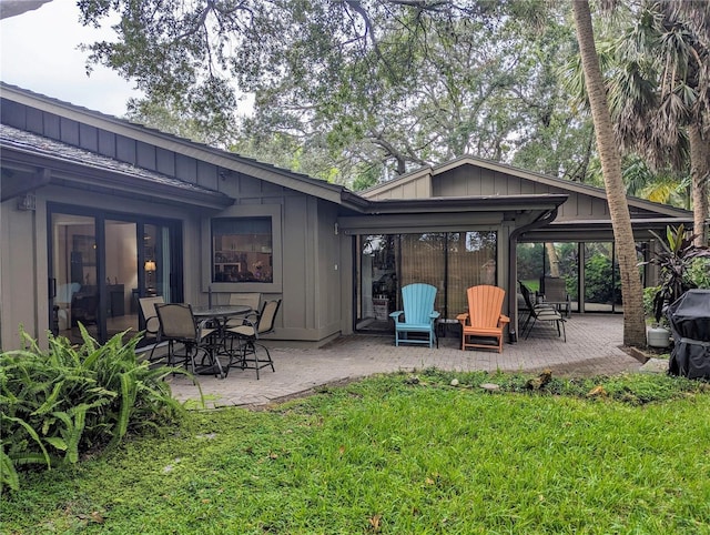 back of house with a patio