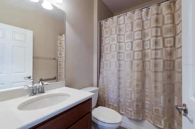 full bathroom with vanity and toilet