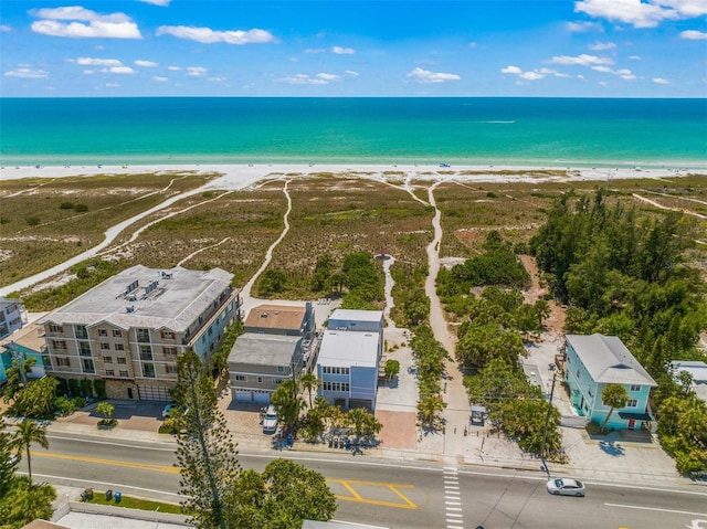 birds eye view of property featuring a water view and a view of the beach