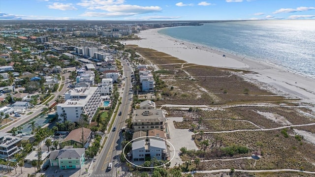 bird's eye view featuring a water view and a view of the beach